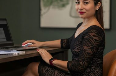 pexels photo 25651531 25651531 Confident businesswoman in stylish dress working on a laptop at her desk.